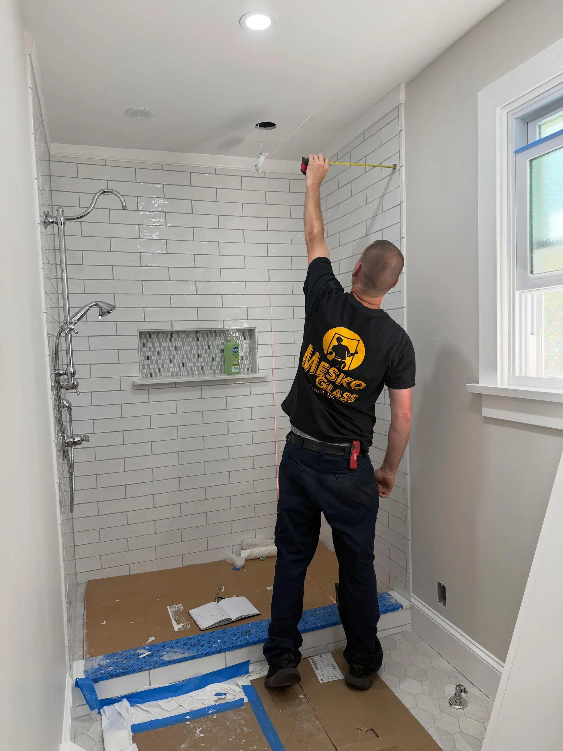 Glass shower enclosure work by Mesko Glass.